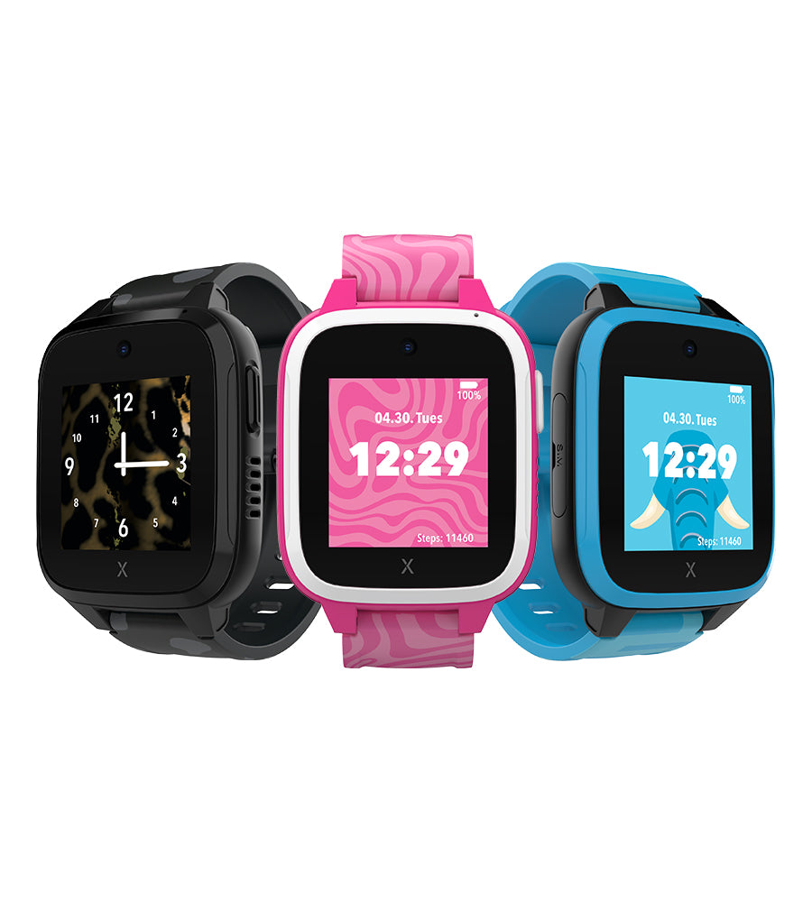 Three vibrant XGO3 Kids smartwatches displayed side by side, featuring designs for kids: black panther with camouflage, pink zebra with a swirl pattern, and blue elephant with playful graphics