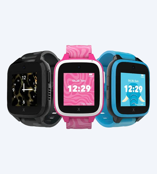 Three vibrant XGO3 Kids smartwatches displayed side by side, featuring designs for kids: black panther with camouflage, pink zebra with a swirl pattern, and blue elephant with playful graphics