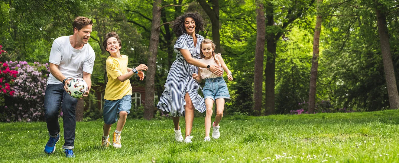 Kids playing outside with their parents away from social media