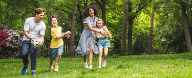 Kids playing outside with their parents away from social media