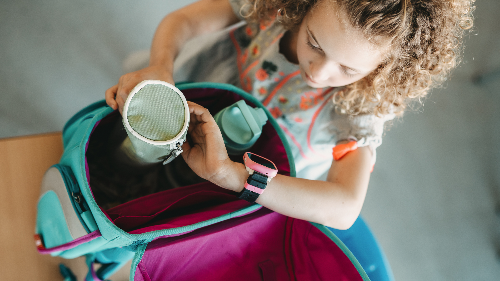 School kid checking her kids watch with school mode activated