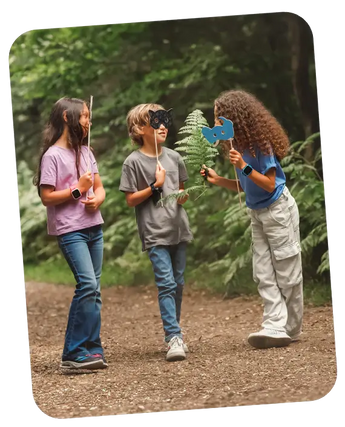 Kids playing around in the forest with their smartwatches with gps on their wrist!