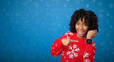 Little girl with a kids smartwatch with calls, messages and GPS. The perfect christmas gift for kids