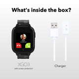 An Xplora XGO3 smartwatch with a black band displayed next to its charger. The smartwatch screen shows an incoming call from 'Dad.' Text above asks, 'What’s inside the box?