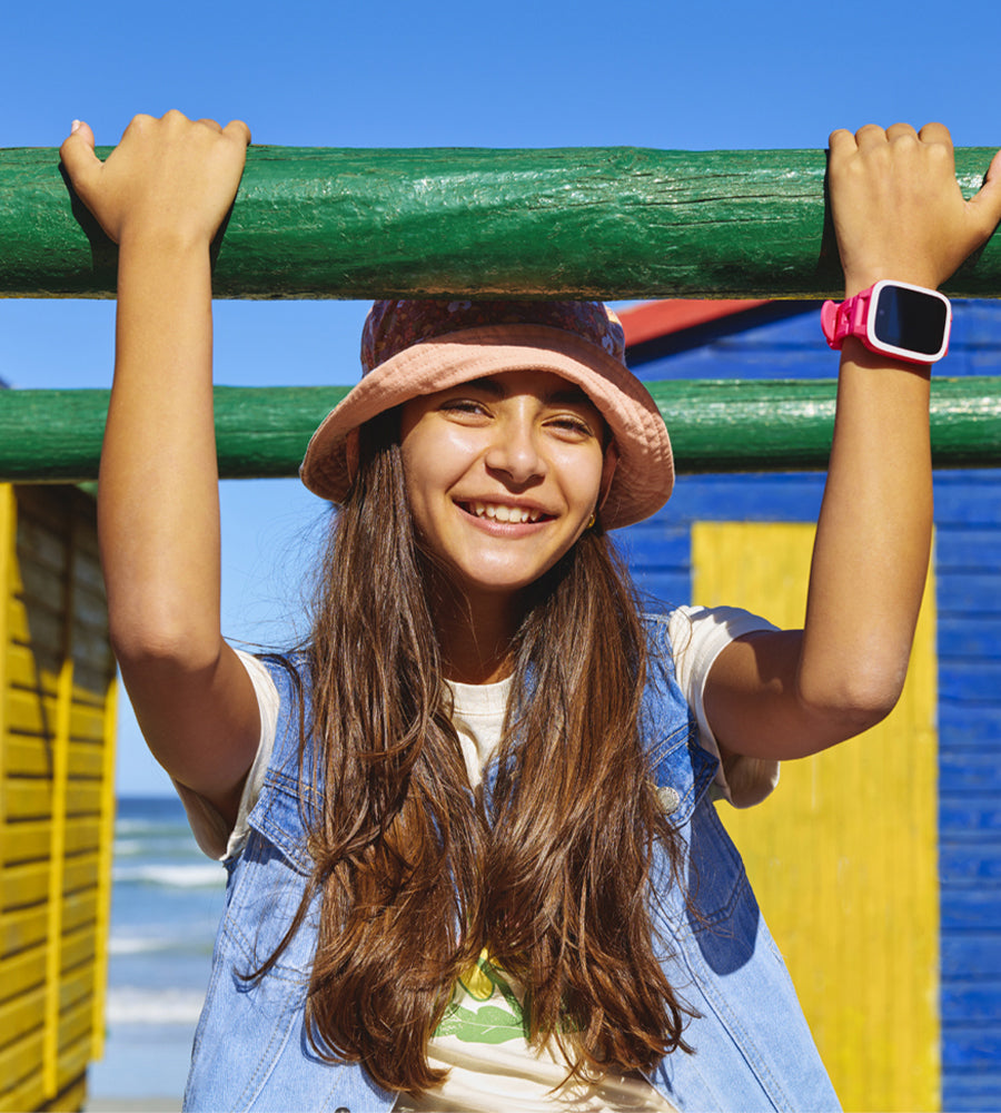 Kids smartwatch. Xplora XGO3 model. Entry level best price. Product photo. With girl playing outside. 